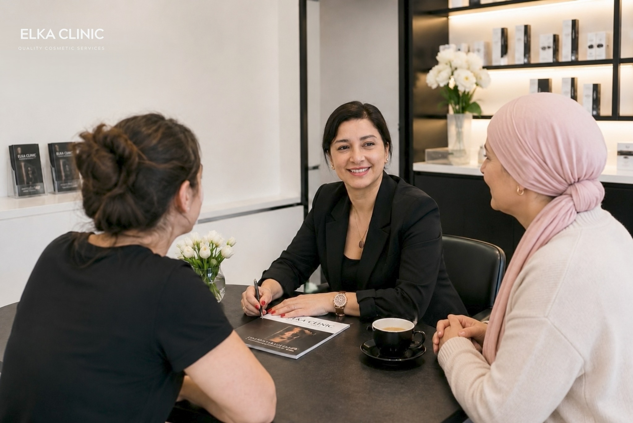 Ellie from ELKA CLINIC speaking with a charity representative during a consultation at the Perth clinic
